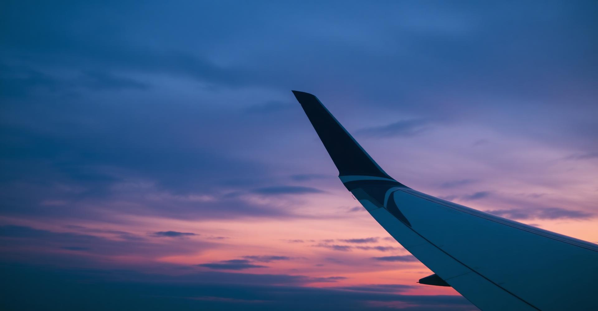 Airplane wing at dusk
